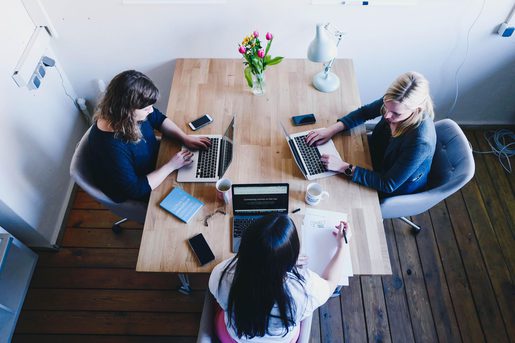 Women working together round table